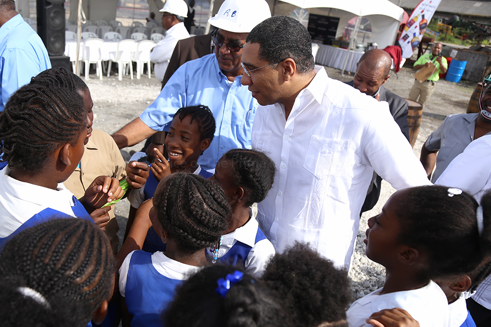 PM Holness interacts with students after touring the Moneymusk Sugar Factory