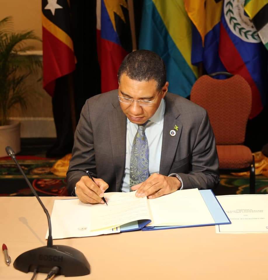 PM Holness Signs Instrument on CARICOM Multilateral Air Services Agreement