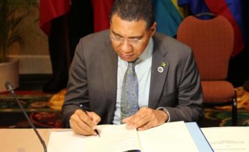 PM Holness Signs Instrument on CARICOM Multilateral Air Services Agreement
