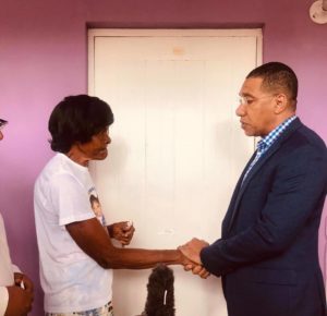 PM Holness Hands Over Keys to Refurbished Home to Fire Victims
