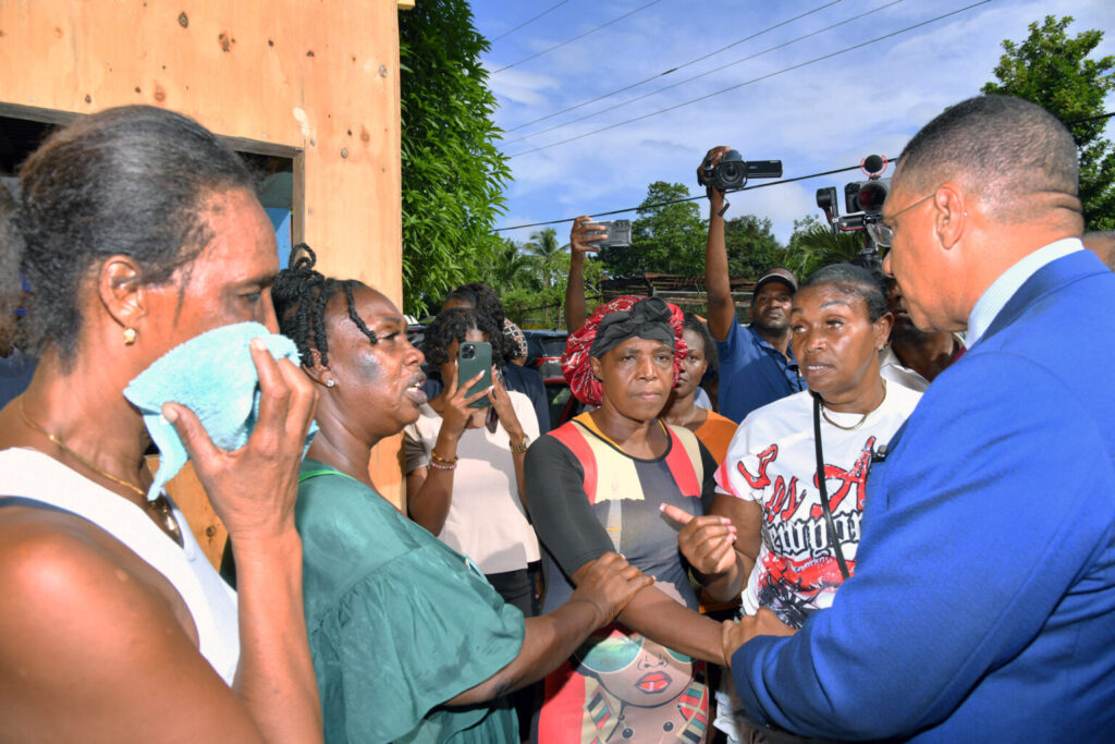 Prime Minister Holness Visits Grieving Families in Commodore, Linstead, St. Catherine