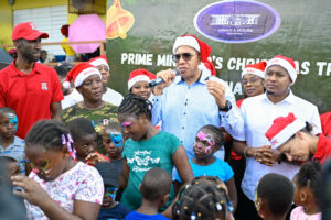 Prime Minister Holness Takes Christmas Treats to Hurricane-Affected Communities in Western Jamaica